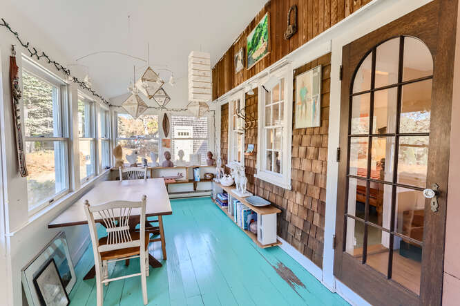 76 State Road Chilmark, MA 02535 - Photo 47 of 79 a room with lots of furniture and a large window