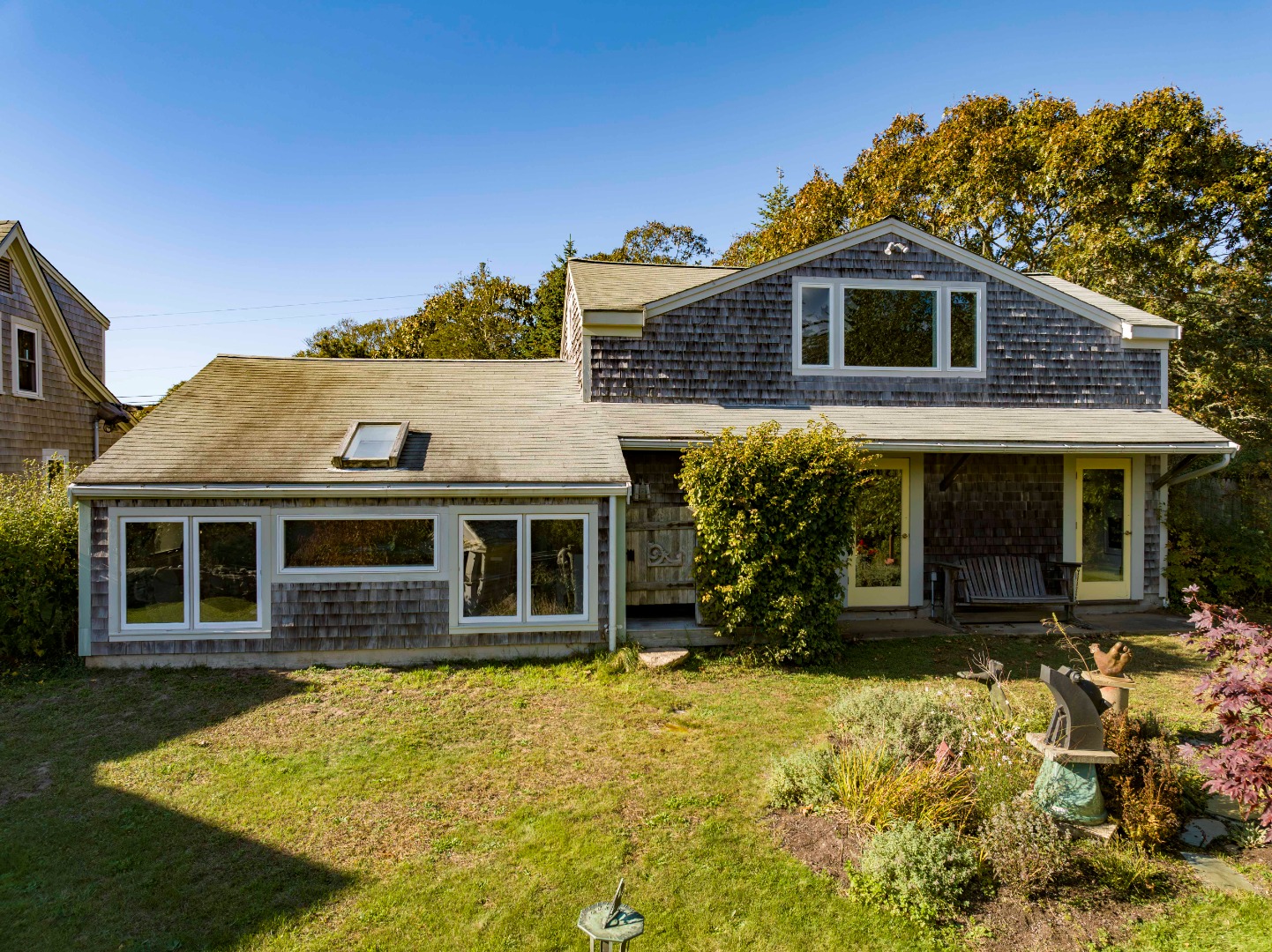 76 State Road Chilmark, MA 02535 - Photo 49 of 79 a front view of a house with a yard