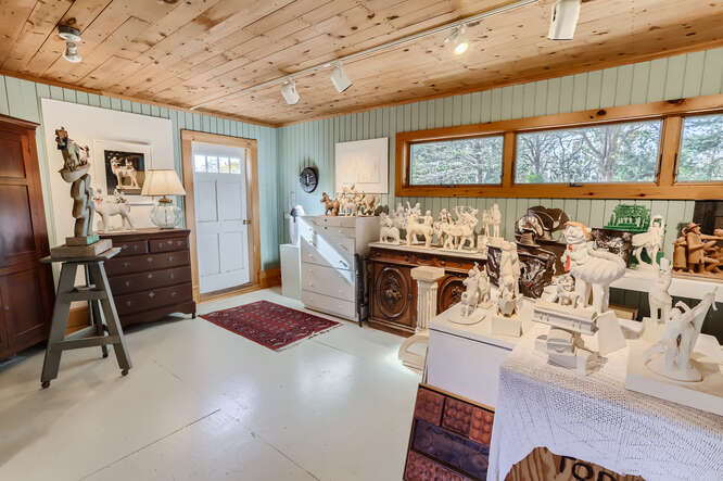 76 State Road Chilmark, MA 02535 - Photo 50 of 79 a living room with furniture a flat screen tv and a table