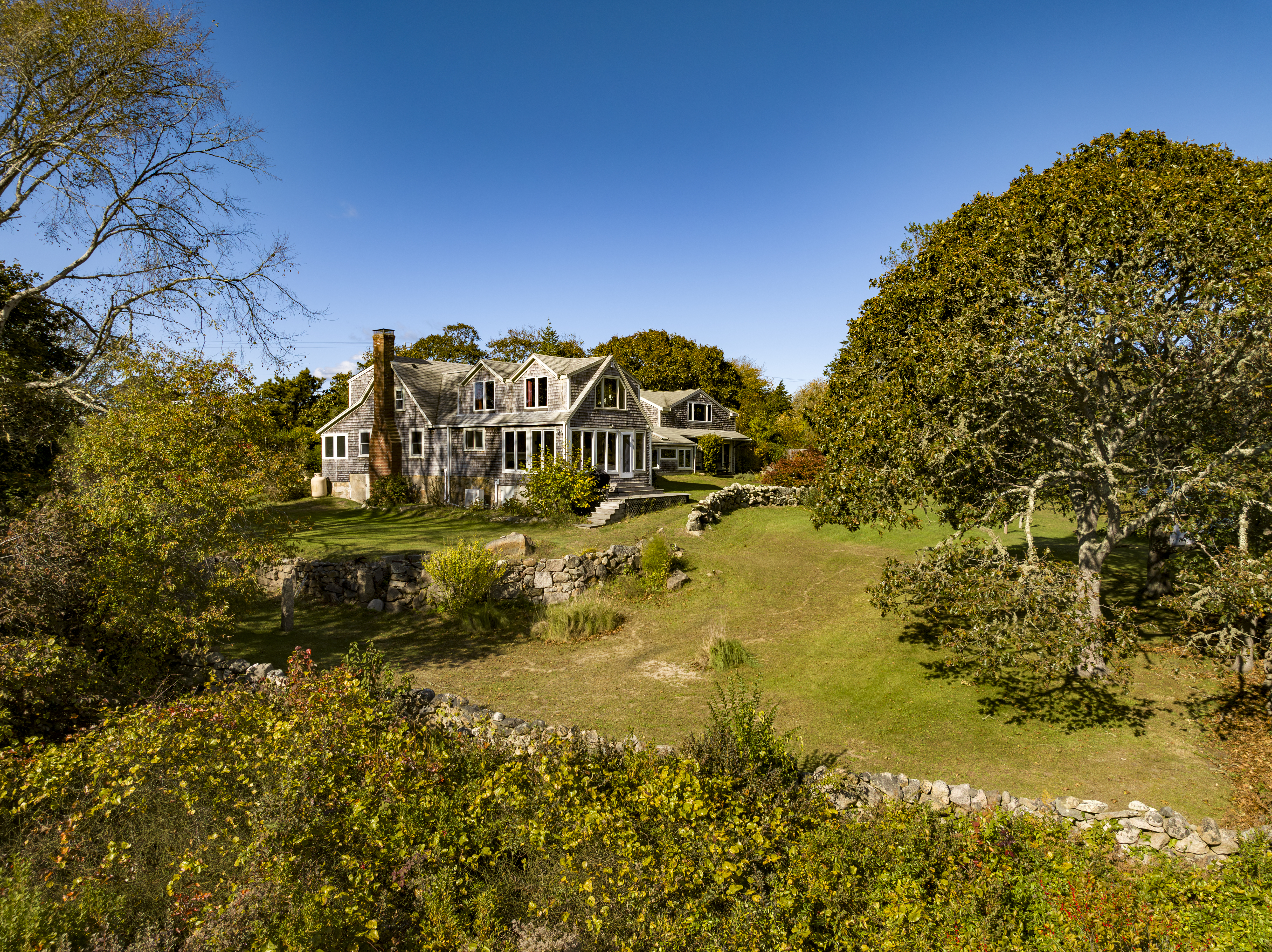 76 State Road Chilmark, MA 02535 - Photo 64 of 79 a view of a lake with a building in the background