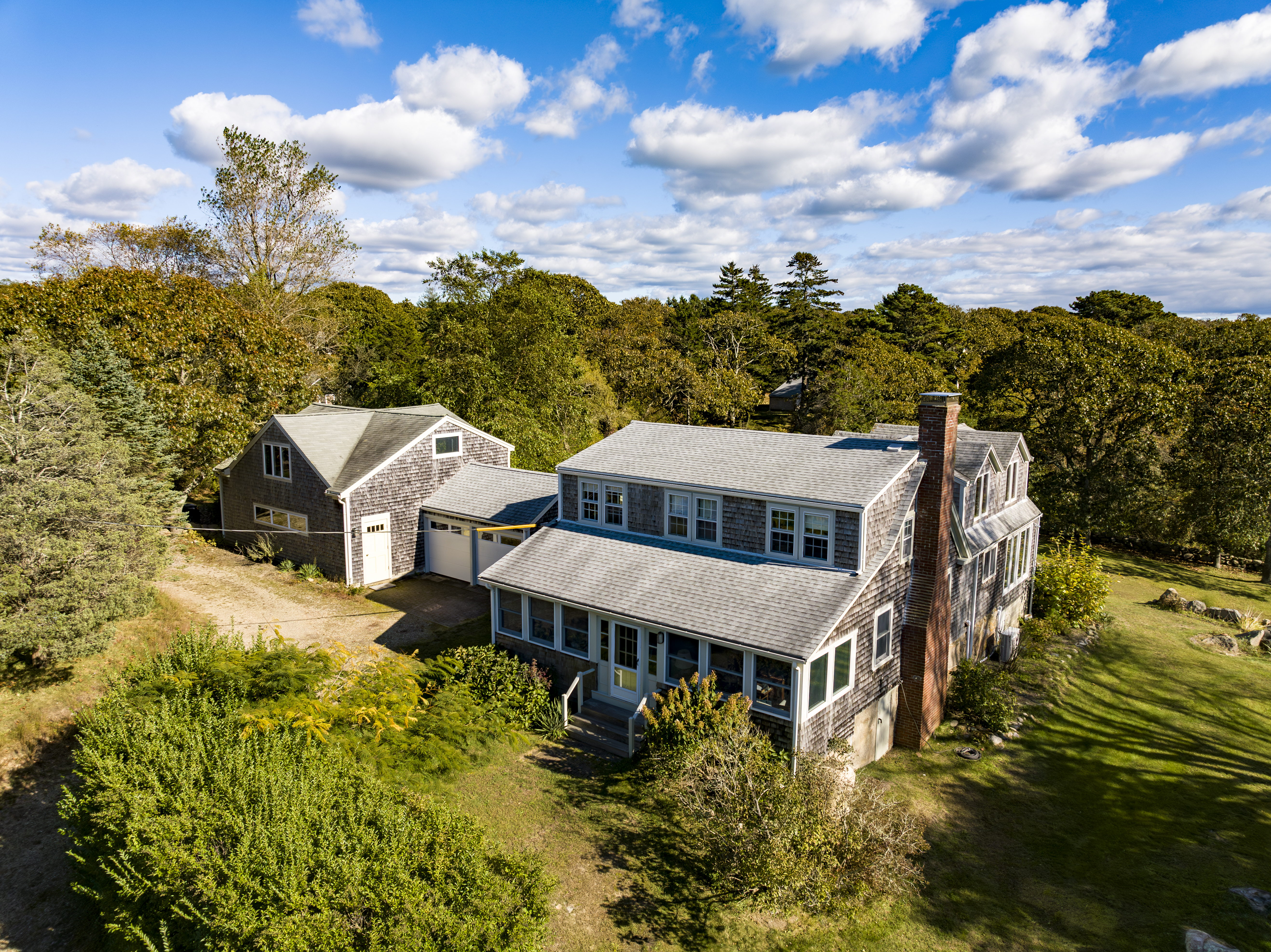 76 State Road Chilmark, MA 02535 - Photo 65 of 79 a view of a big house with a big yard and large tree