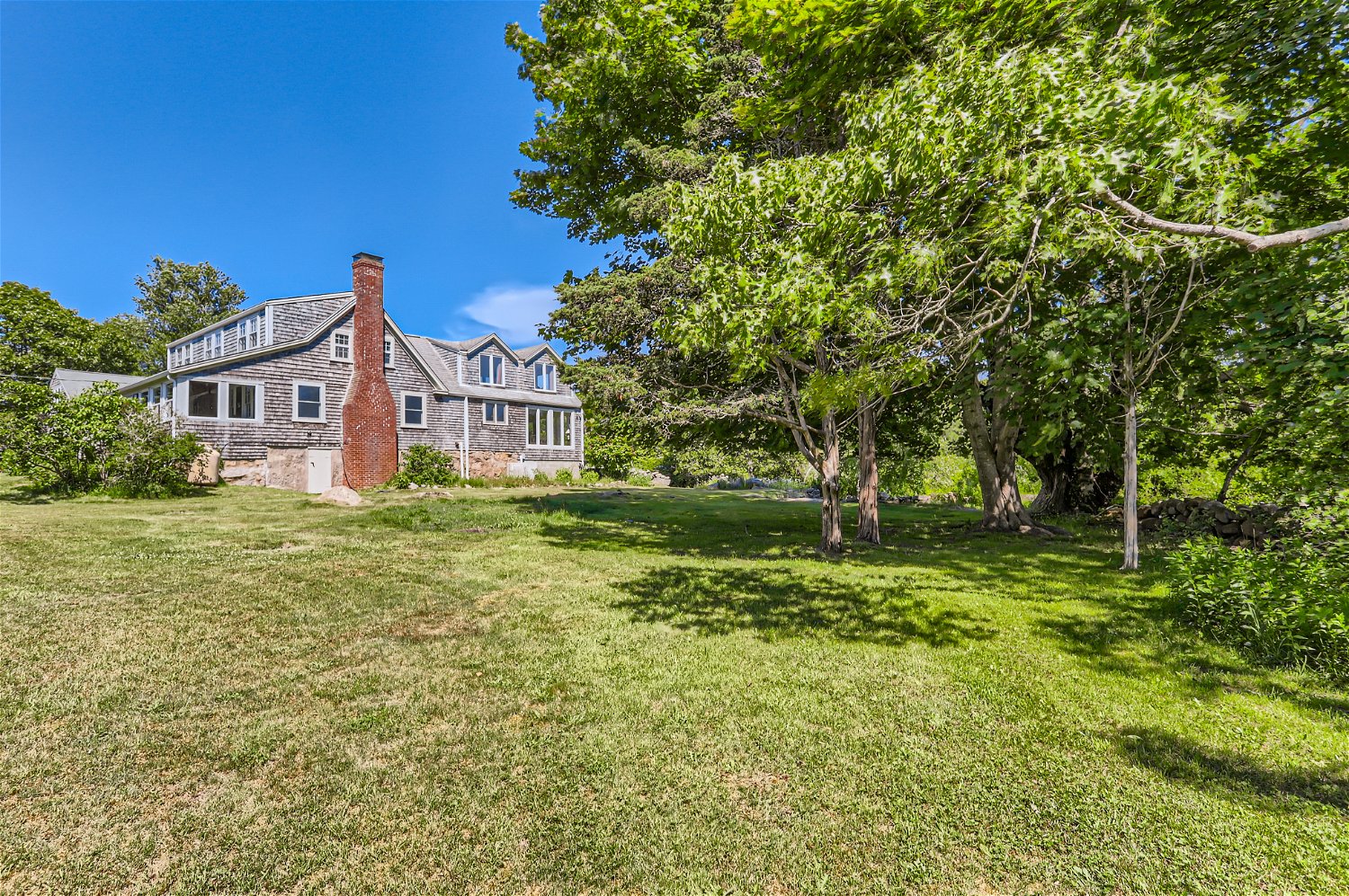 76 State Road Chilmark, MA 02535 - Photo 66 of 79 a view of a house with a yard