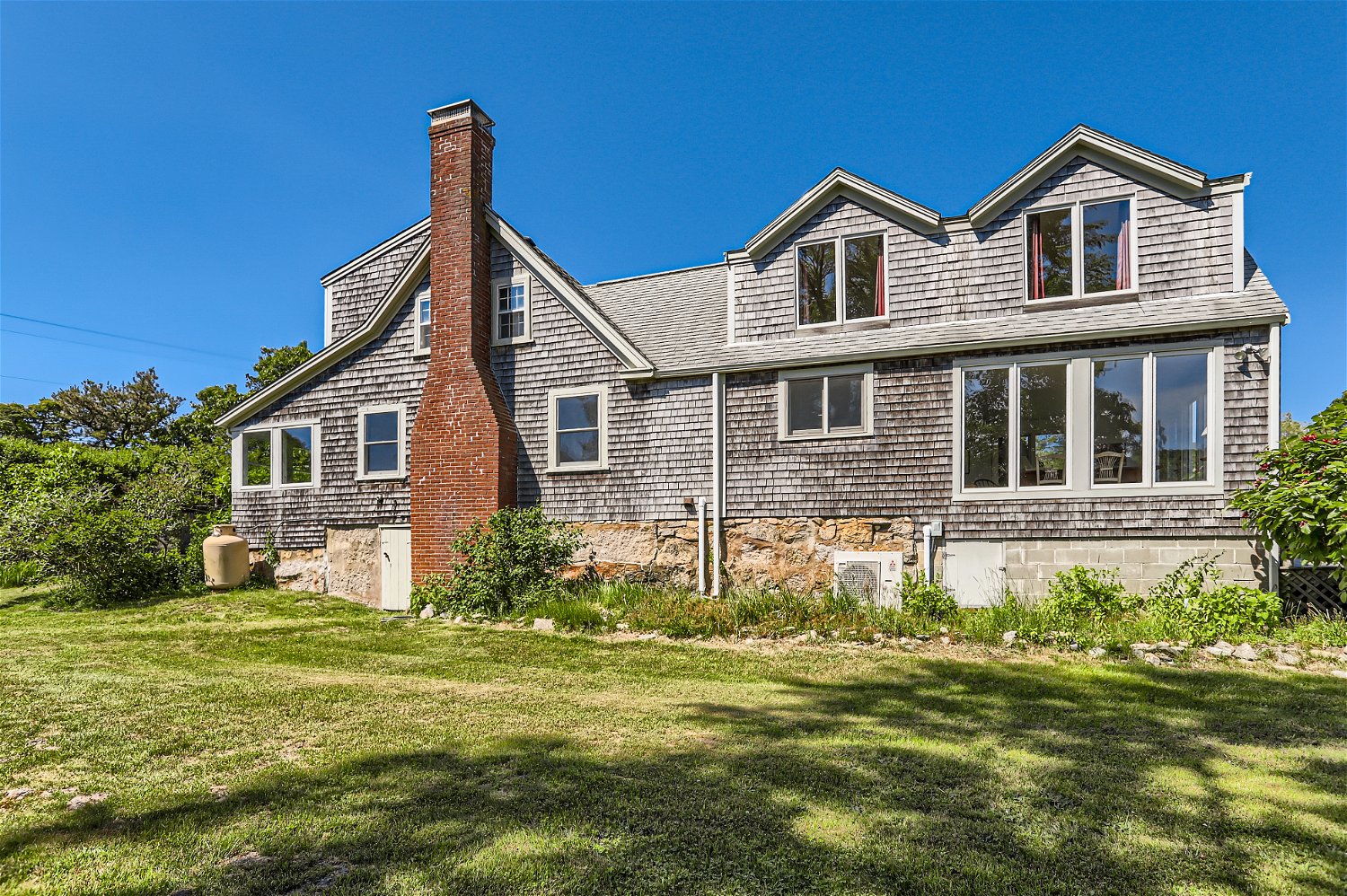 76 State Road Chilmark, MA 02535 - Photo 68 of 79 a front view of a house with a yard