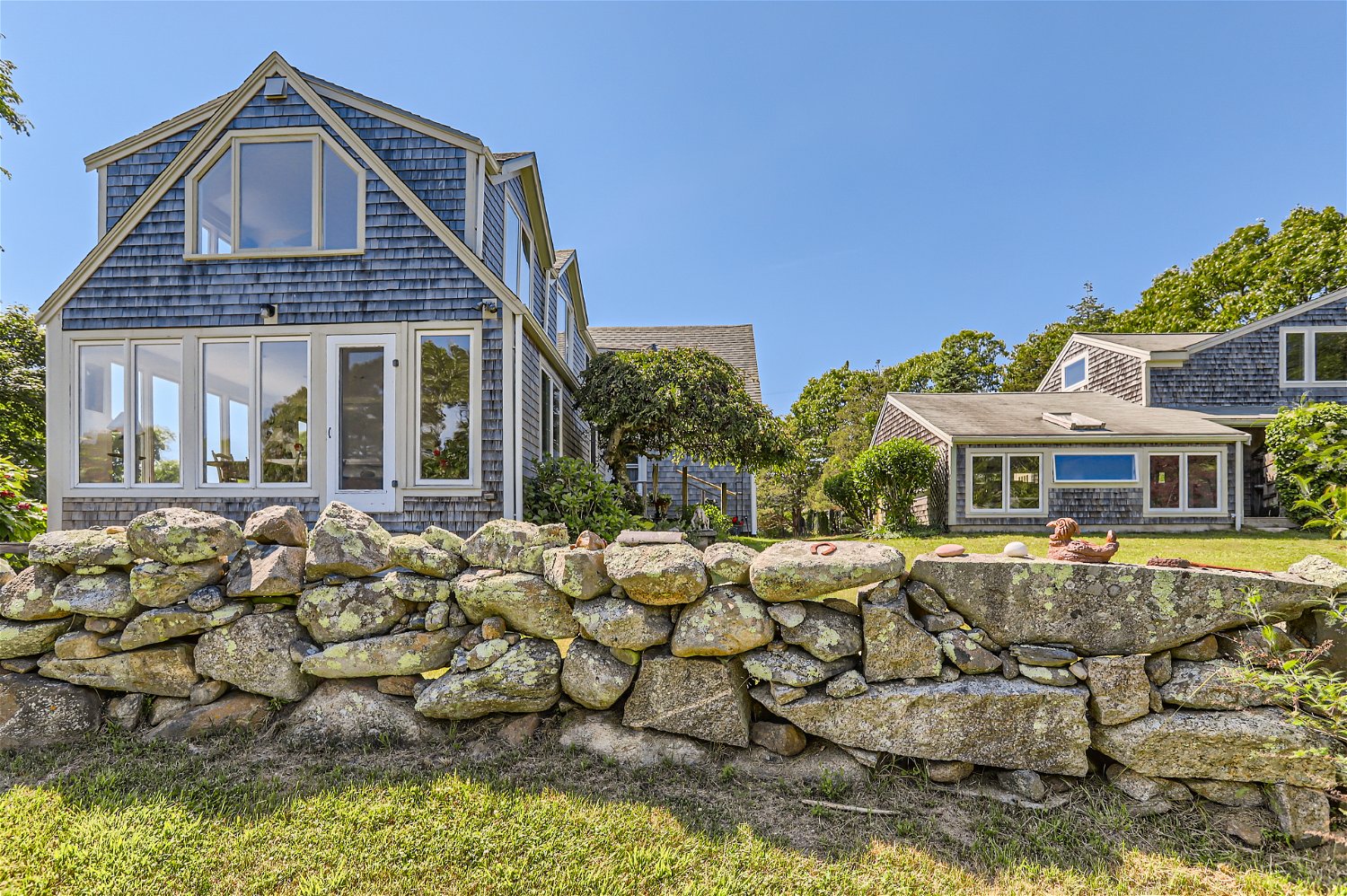 76 State Road Chilmark, MA 02535 - Photo 69 of 79 a front view of a house with a yard