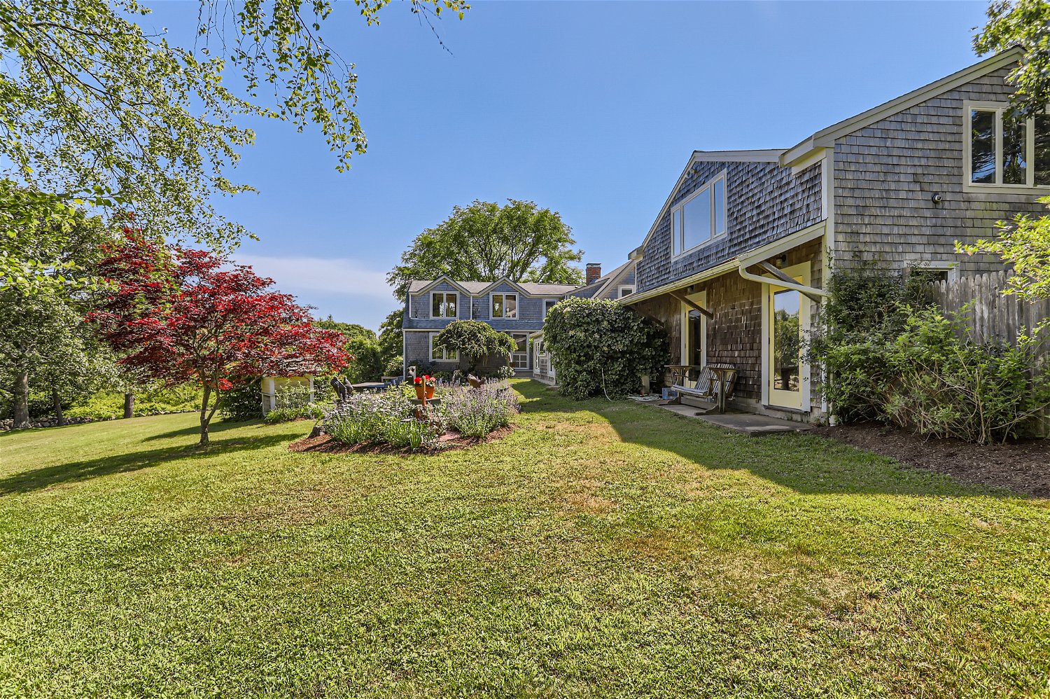 76 State Road Chilmark, MA 02535 - Photo 79 of 79 a view of a house with a yard and sitting area