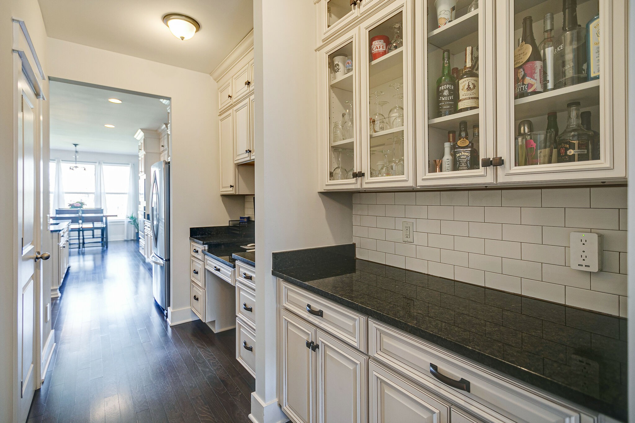 902 Beamon Drive Franklin, TN 37064 - Photo 11 of 41 a kitchen with granite countertop a stove a sink and a refrigerator