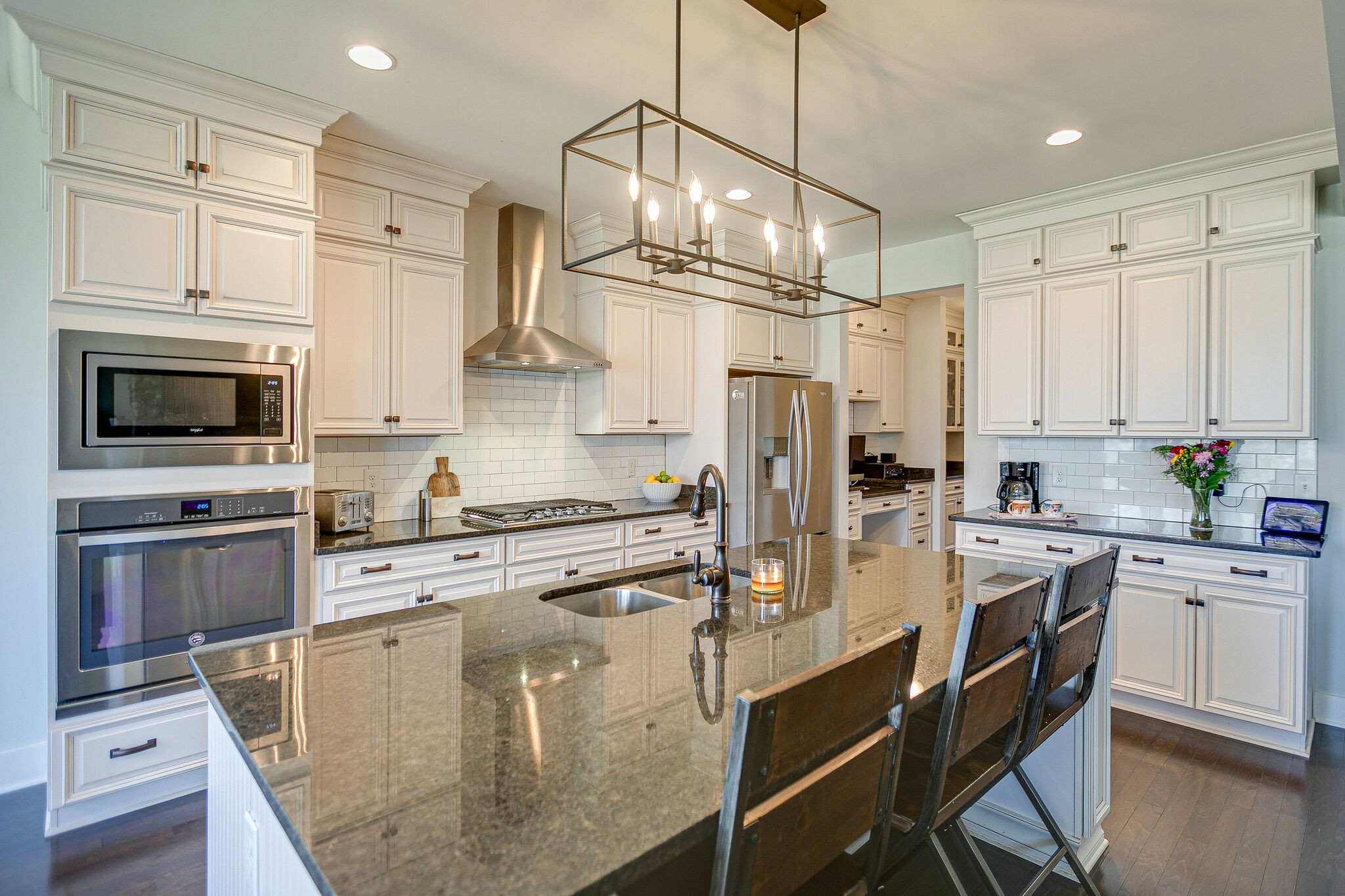 902 Beamon Drive Franklin, TN 37064 - Photo 17 of 41 a large kitchen with stainless steel appliances granite countertop a stove refrigerator and white cabinets with wooden floor