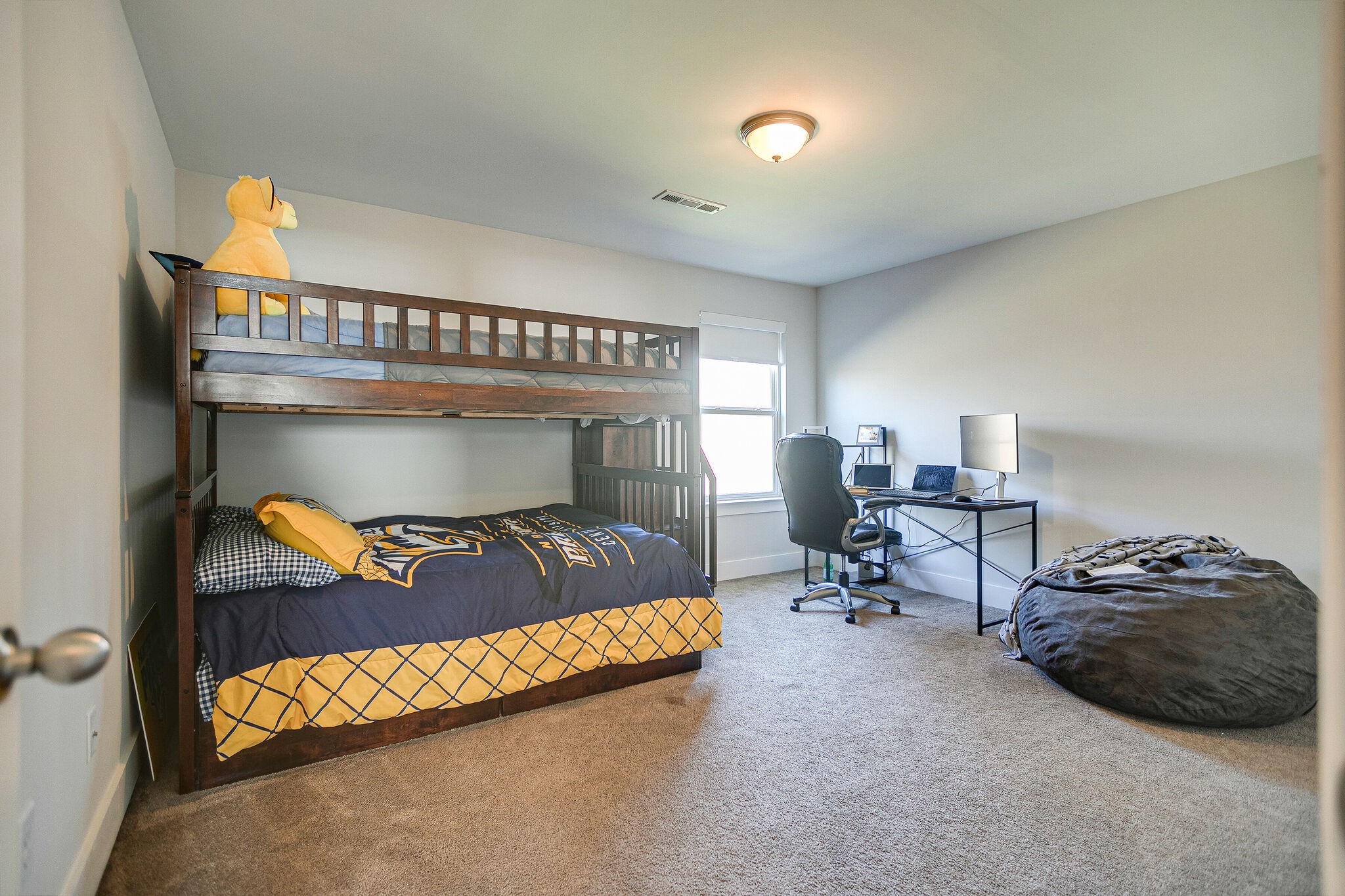 902 Beamon Drive Franklin, TN 37064 - Photo 31 of 41 a bedroom with a bed and a chair