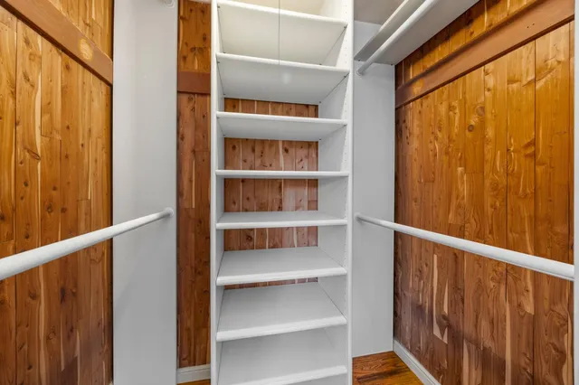 a view of a balcony with wooden floor