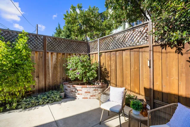 a outdoor space with patio furniture and potted plants