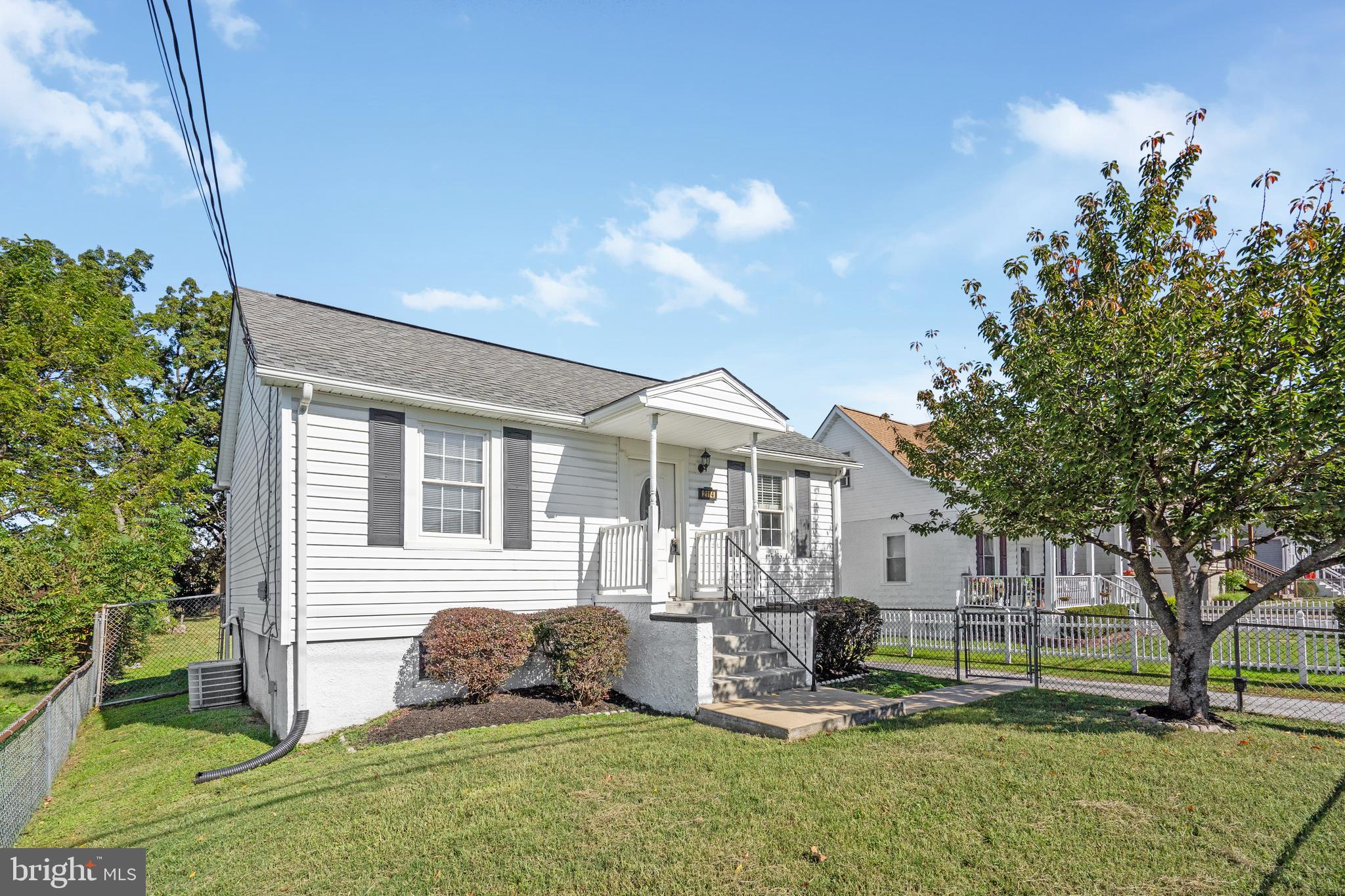 2114 Oakland Road Baltimore, MD 21220 - Photo 1 of 21 a front view of a house with a yard