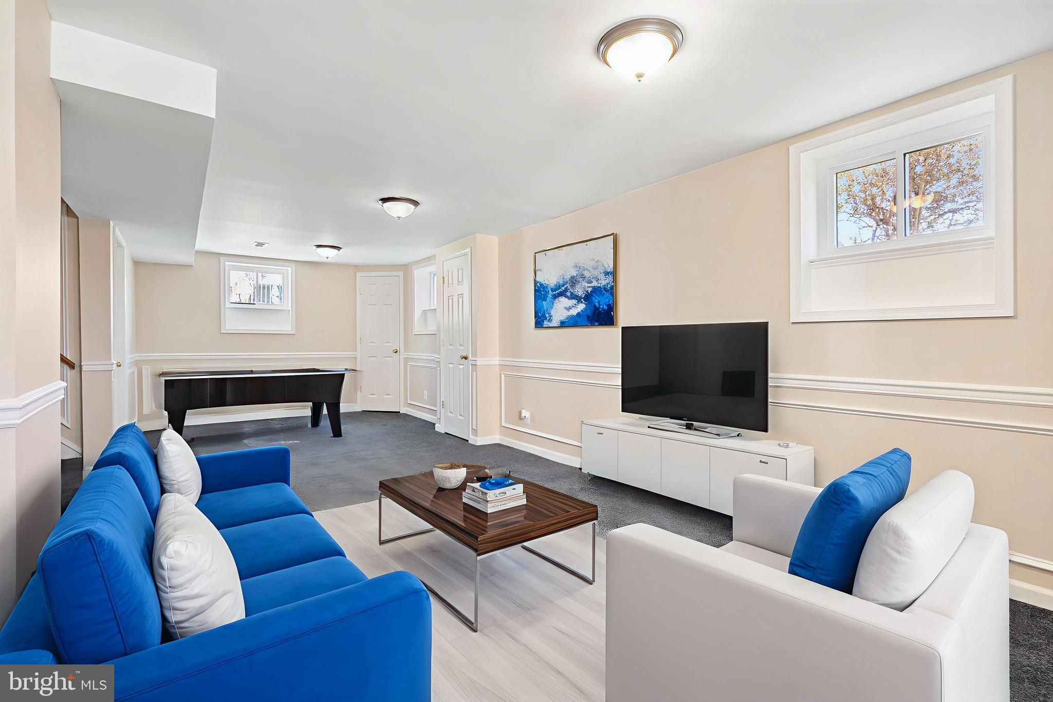 2114 Oakland Road Baltimore, MD 21220 - Photo 11 of 21 a living room with furniture and a flat screen tv