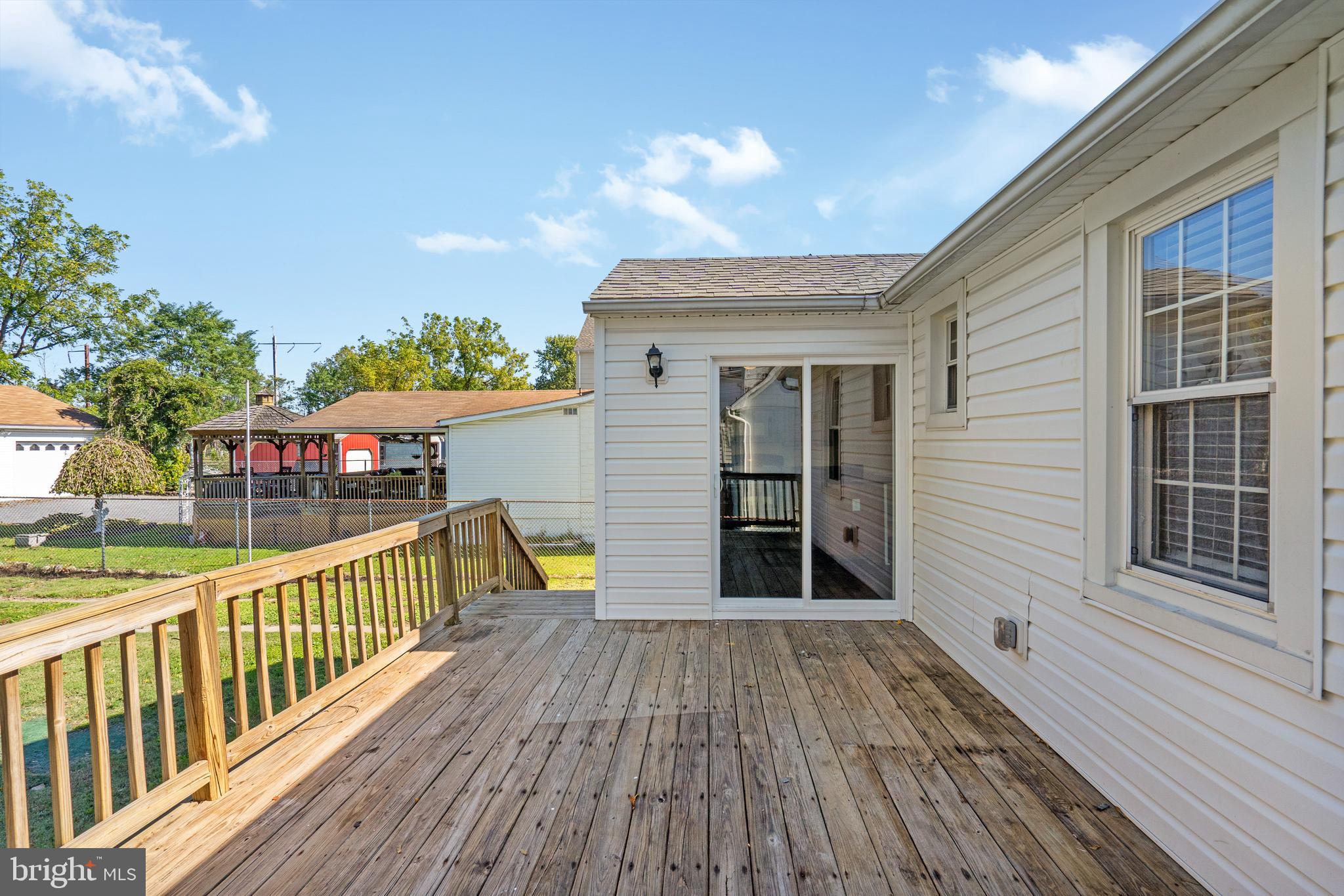 2114 Oakland Road Baltimore, MD 21220 - Photo 16 of 21 a view of a balcony with wooden floor and fence