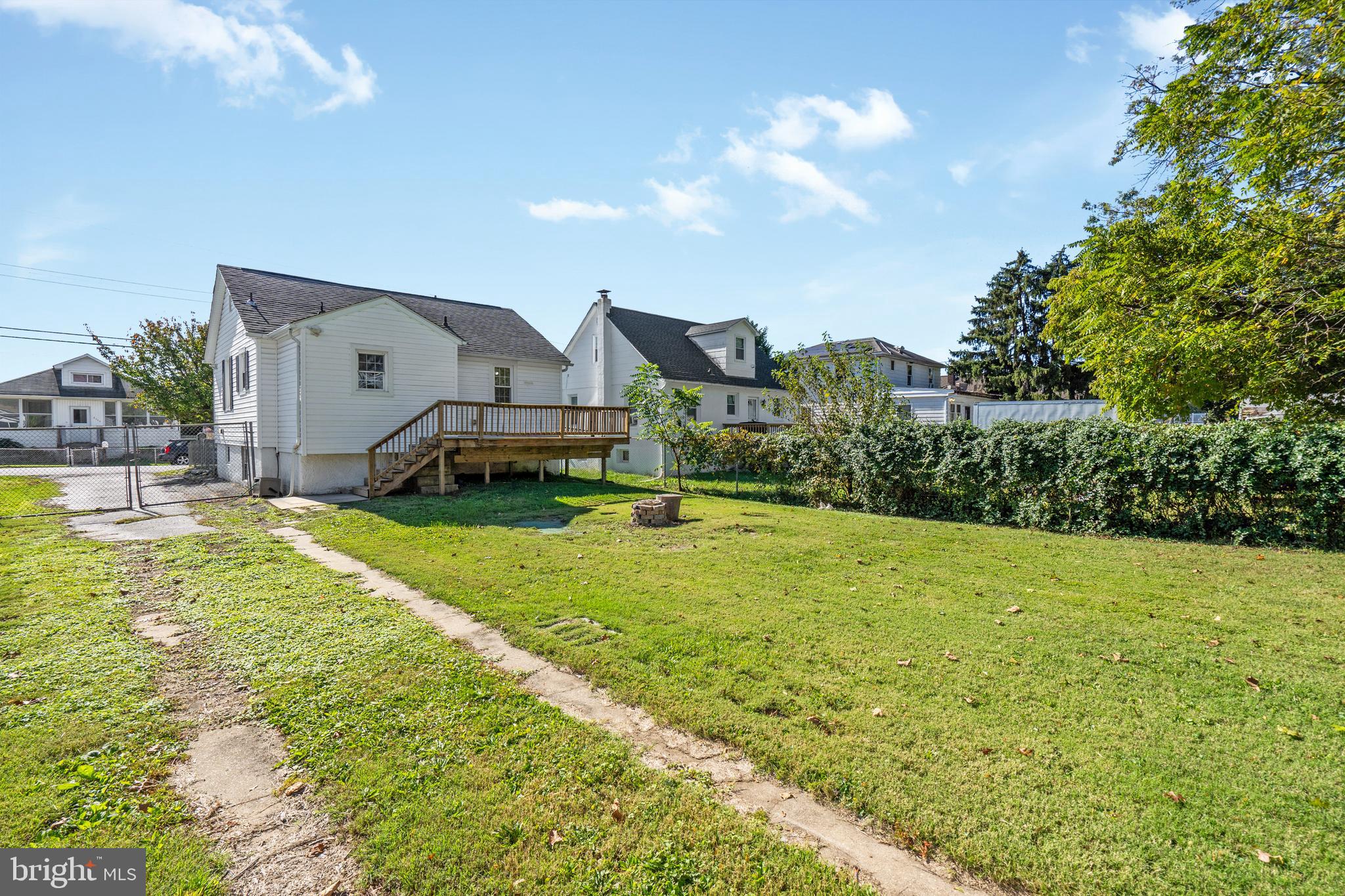 2114 Oakland Road Baltimore, MD 21220 - Photo 19 of 21 a view of a house with a big yard and large trees