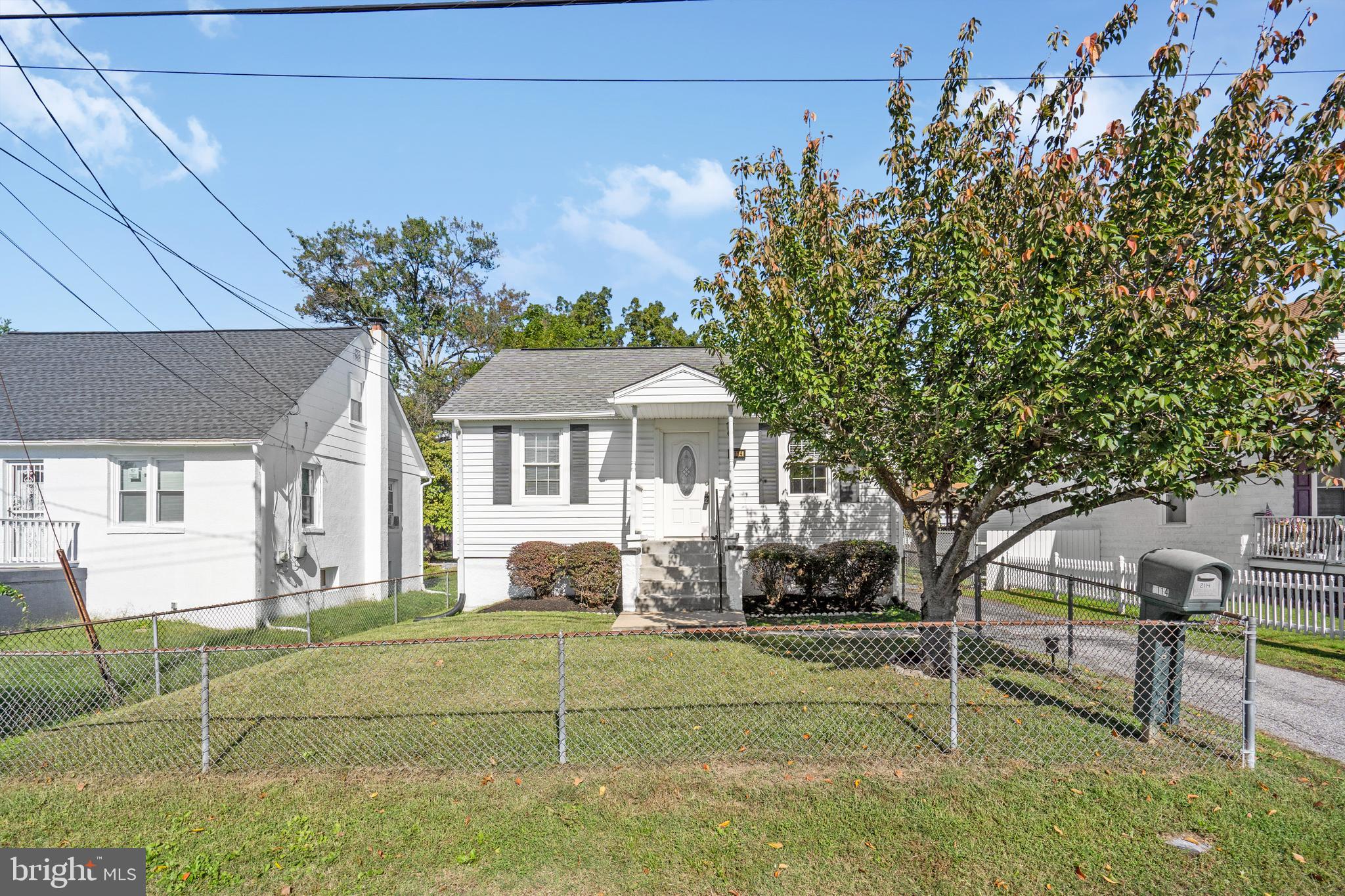 2114 Oakland Road Baltimore, MD 21220 - Photo 2 of 21 a front view of a house with garden