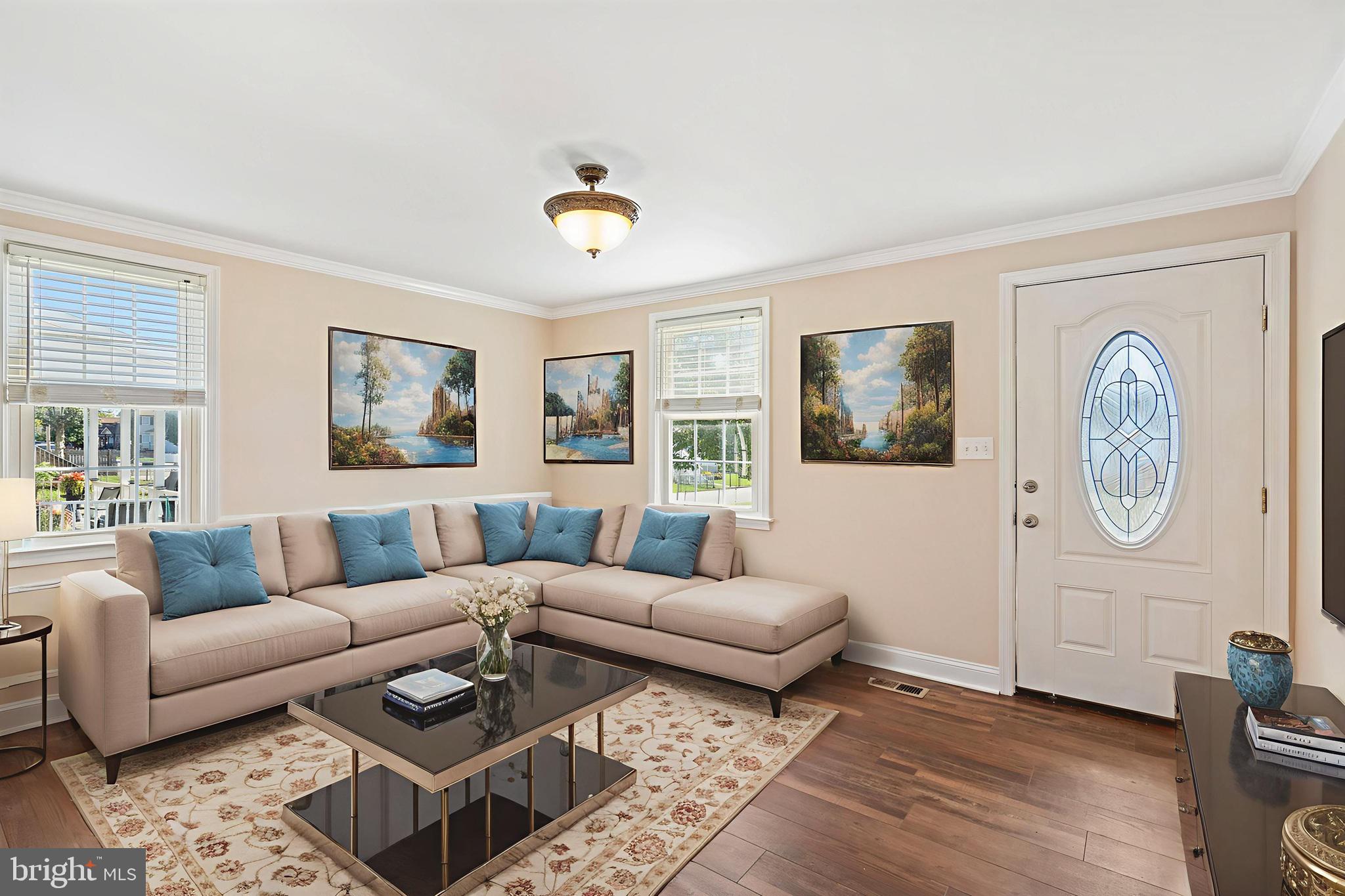2114 Oakland Road Baltimore, MD 21220 - Photo 3 of 21 a living room with furniture a rug and wooden floor