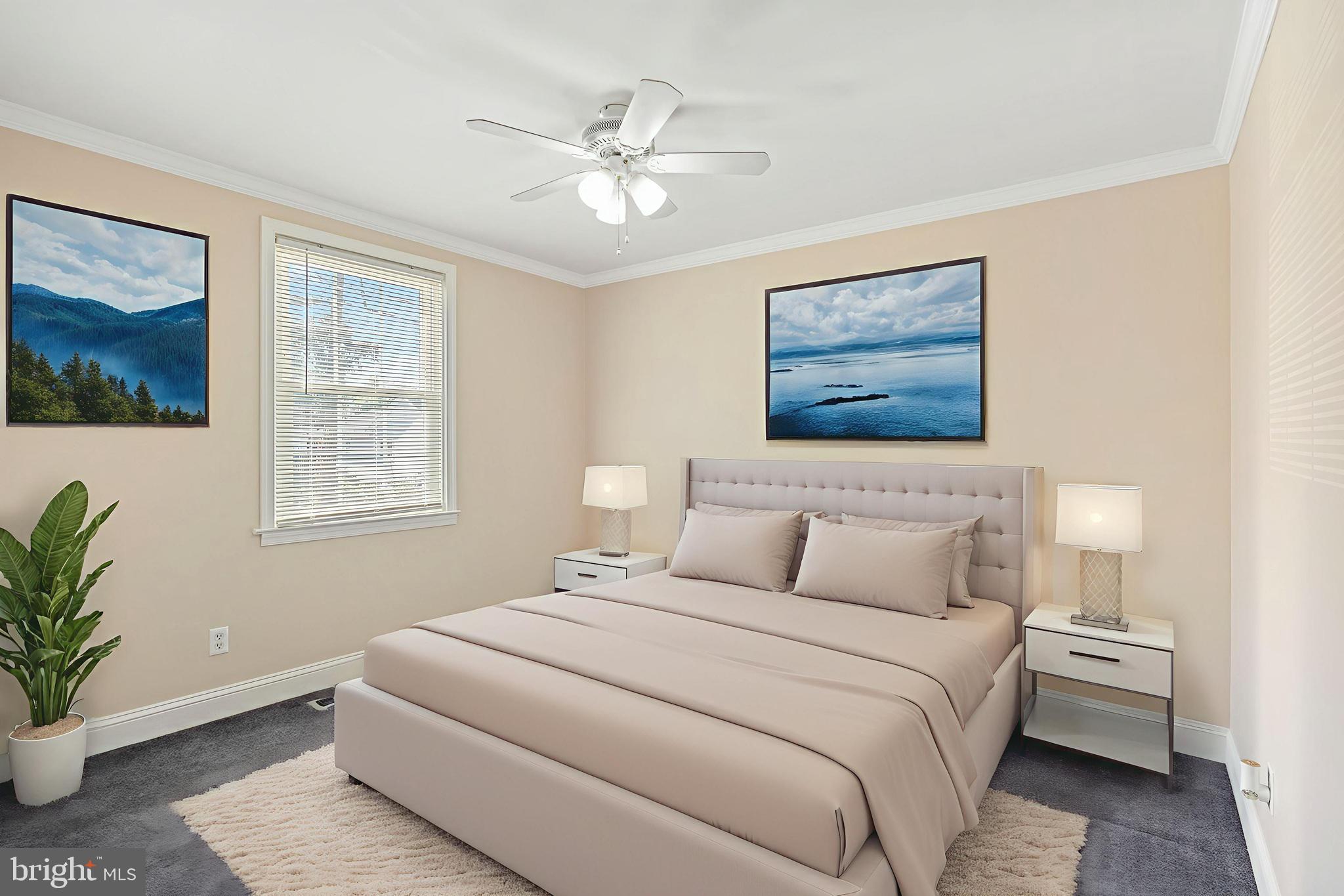 2114 Oakland Road Baltimore, MD 21220 - Photo 9 of 21 a bedroom with a large bed and a chandelier