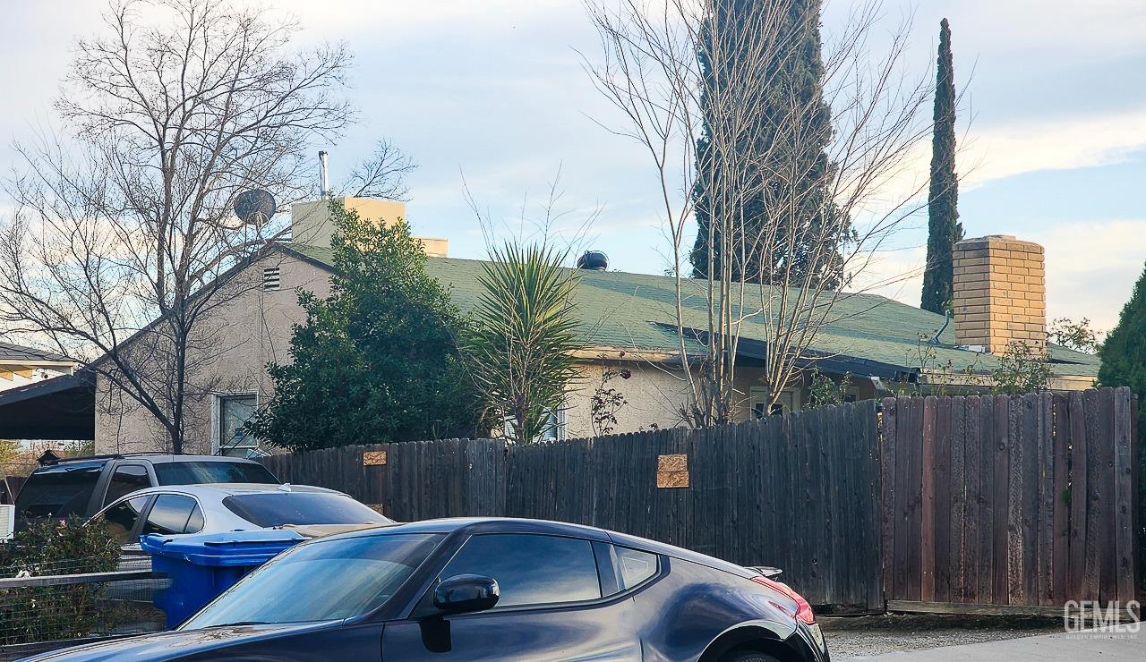 Undisclosed Address Bakersfield, CA 93305 - Photo 3 of 12 a view of roof deck with couches and wooden fence