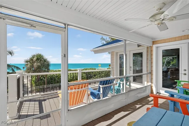 a view of a balcony with floor to ceiling windows with wooden floor