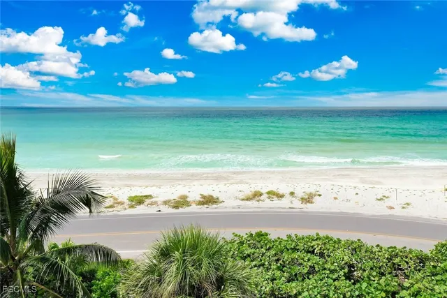 a view of an ocean and a building