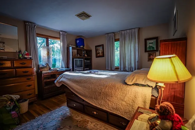 a bed room with a bed and a window