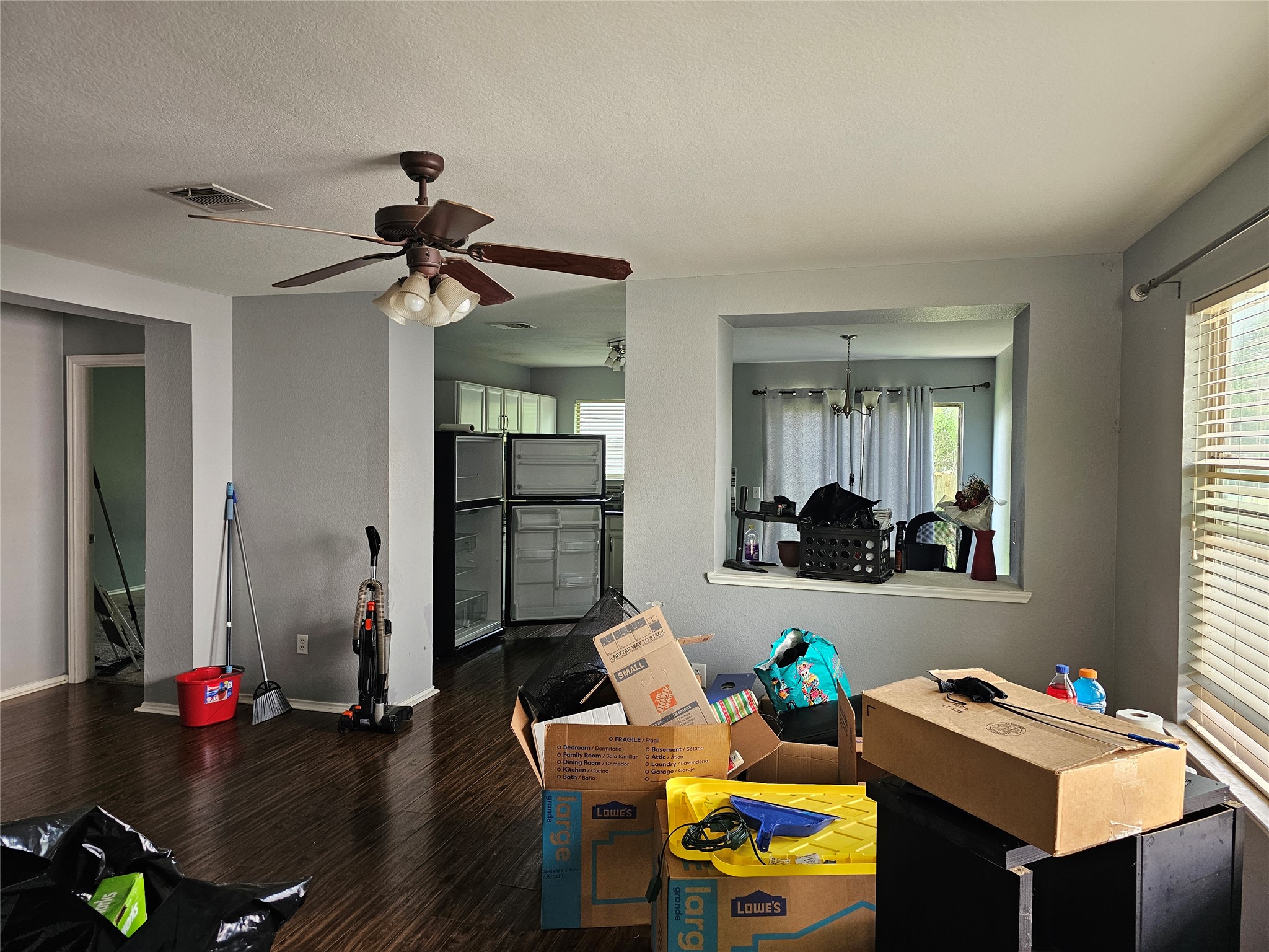 1120 Apollo Circle Round Rock, TX 78664 - Photo 11 of 14 Wood flooring and a refreshing ceiling fan enhance this spacious living area.