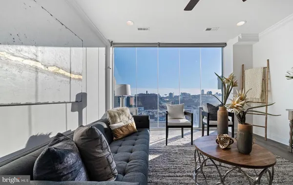 a living room with furniture and a window