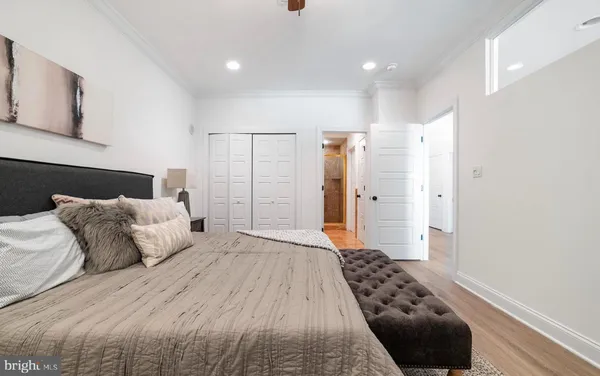 a bedroom with a bed and a walk in closet