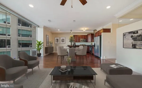 a living room with furniture or kitchen view and a chandelier