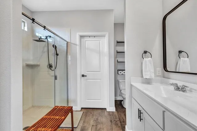 a bathroom with 2 sink and a mirror