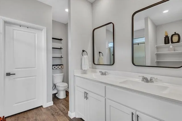 a bathroom with a shower and a sink