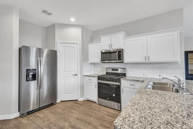 a dining table with chairs and window