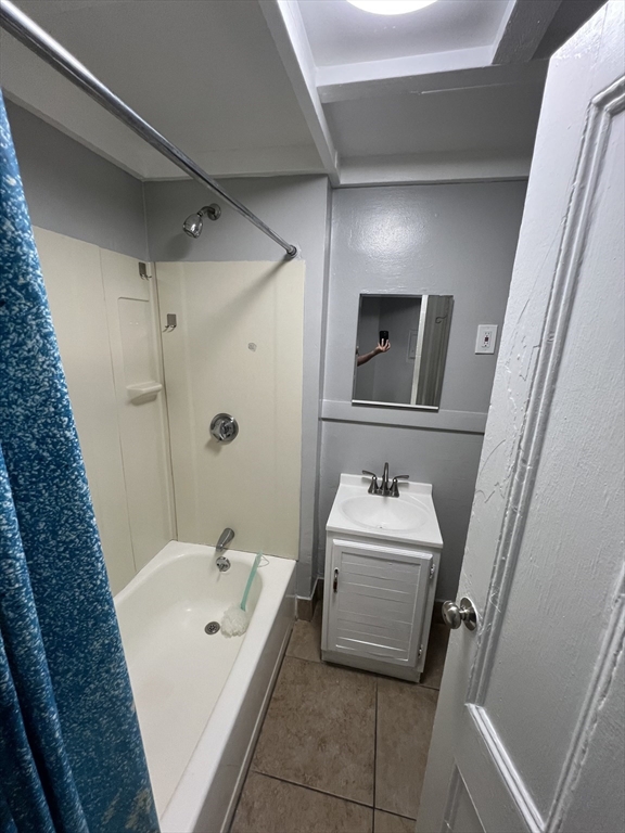 64 Hollis Street, Unit 7 Framingham, MA 01702 - Photo 7 of 7 a bathroom with a sink a toilet and shower