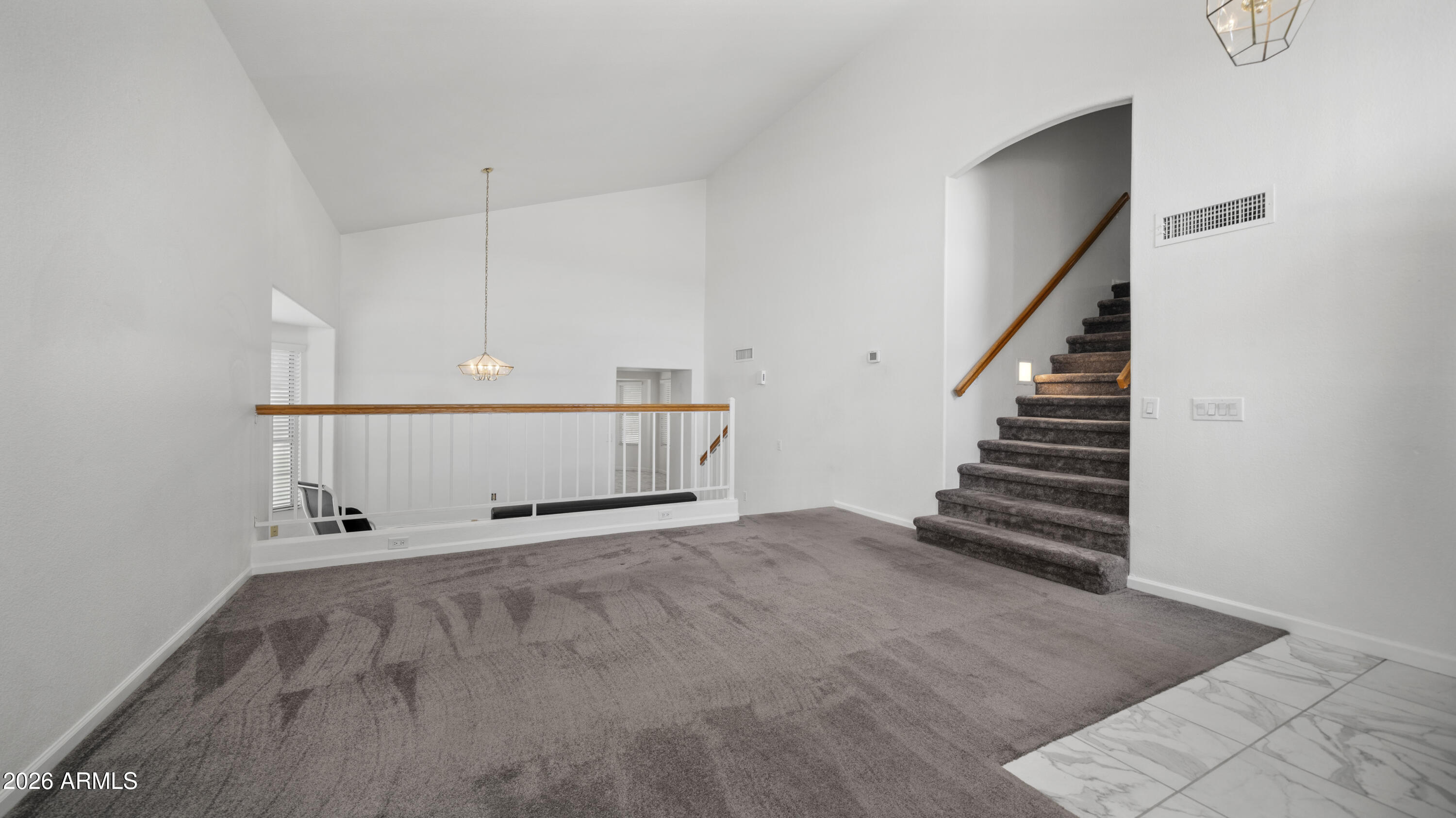 6620 West Redfield Road Glendale, AZ 85306 - Photo 20 of 33 a view of a room with stairs and wooden floor