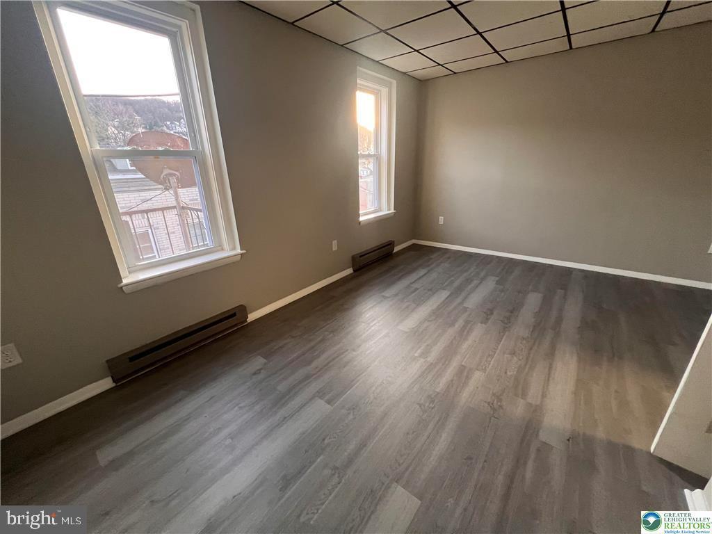 735 Laufer Street Bethlehem, PA 18015 - Photo 11 of 22 an empty room with wooden floor and windows