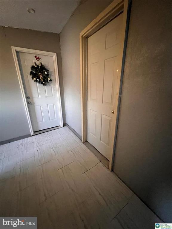 735 Laufer Street Bethlehem, PA 18015 - Photo 14 of 22 an entryway door with a hallway in a house