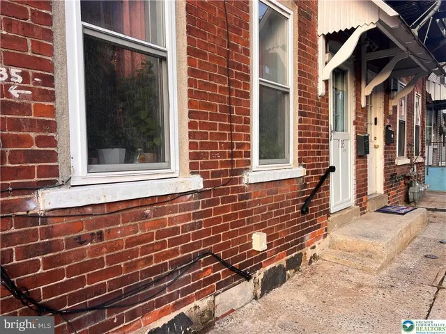 a view of brick buildings with many windows