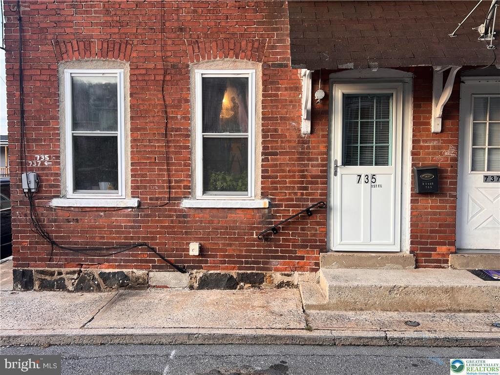735 Laufer Street Bethlehem, PA 18015 - Photo 19 of 22 a front view of a house with a yard and garage