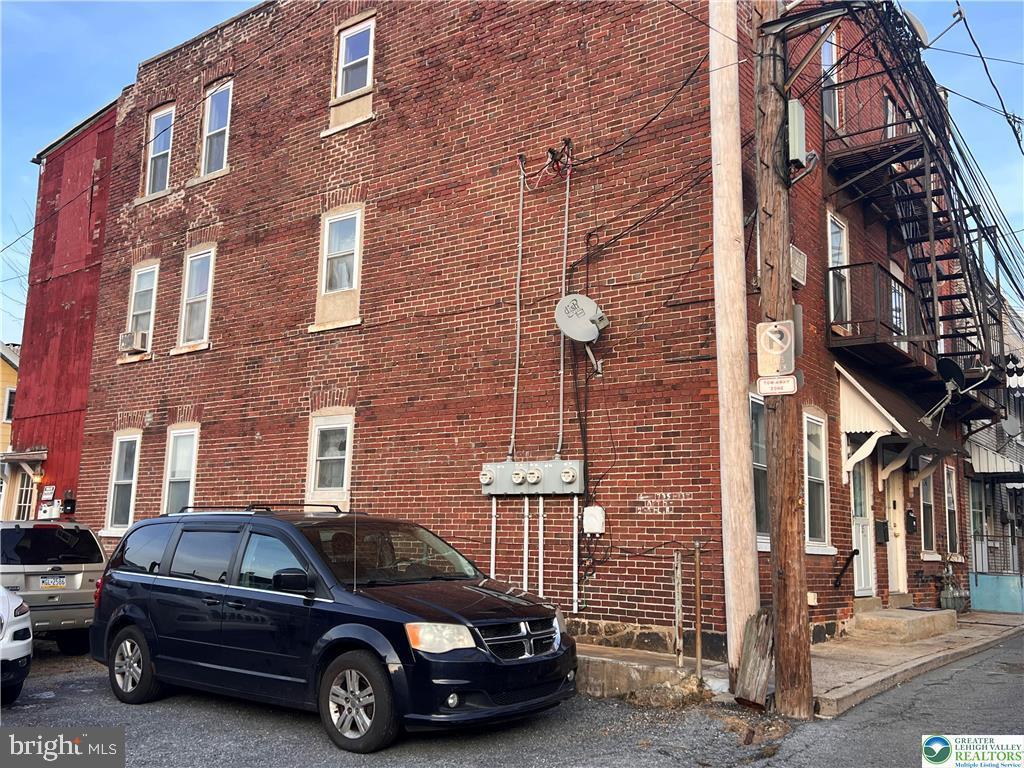 735 Laufer Street Bethlehem, PA 18015 - Photo 3 of 22 a car parked in front of a brick building