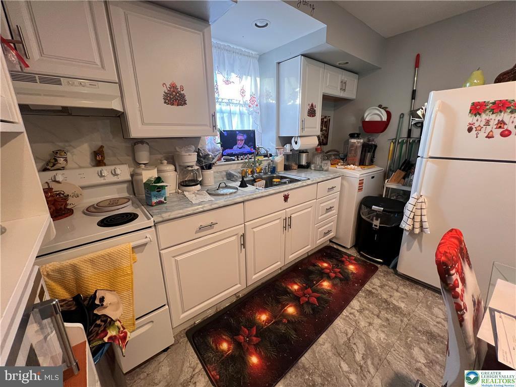 735 Laufer Street Bethlehem, PA 18015 - Photo 6 of 22 a kitchen with a sink appliances and cabinets