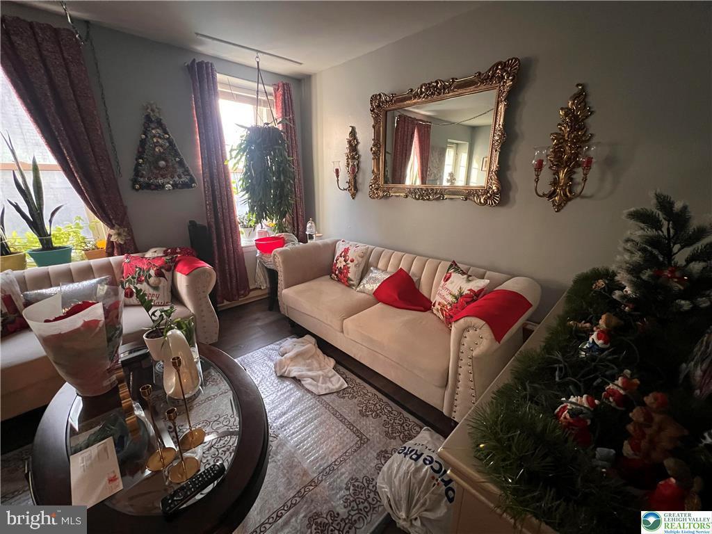 735 Laufer Street Bethlehem, PA 18015 - Photo 7 of 22 a living room with furniture and a potted plant