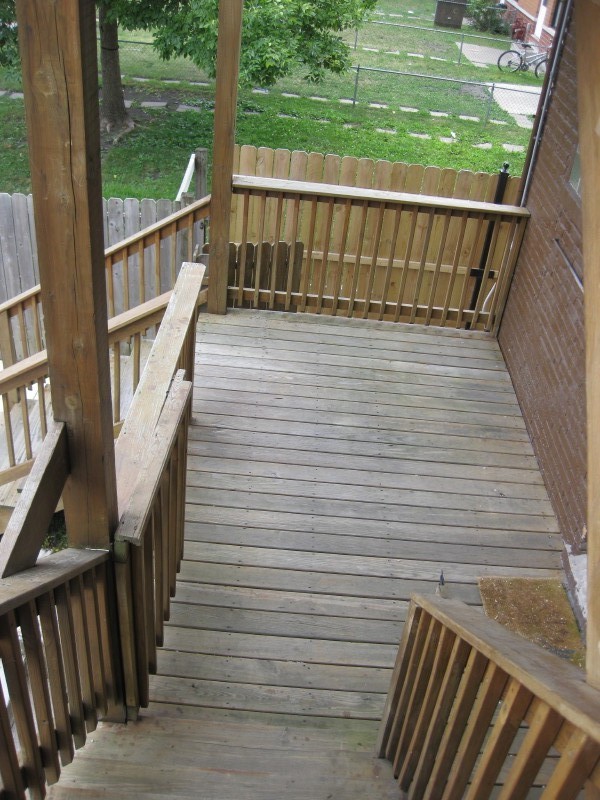 Undisclosed Address Chicago, IL 60622 - Photo 14 of 15 a view of a balcony with wooden floor and fence