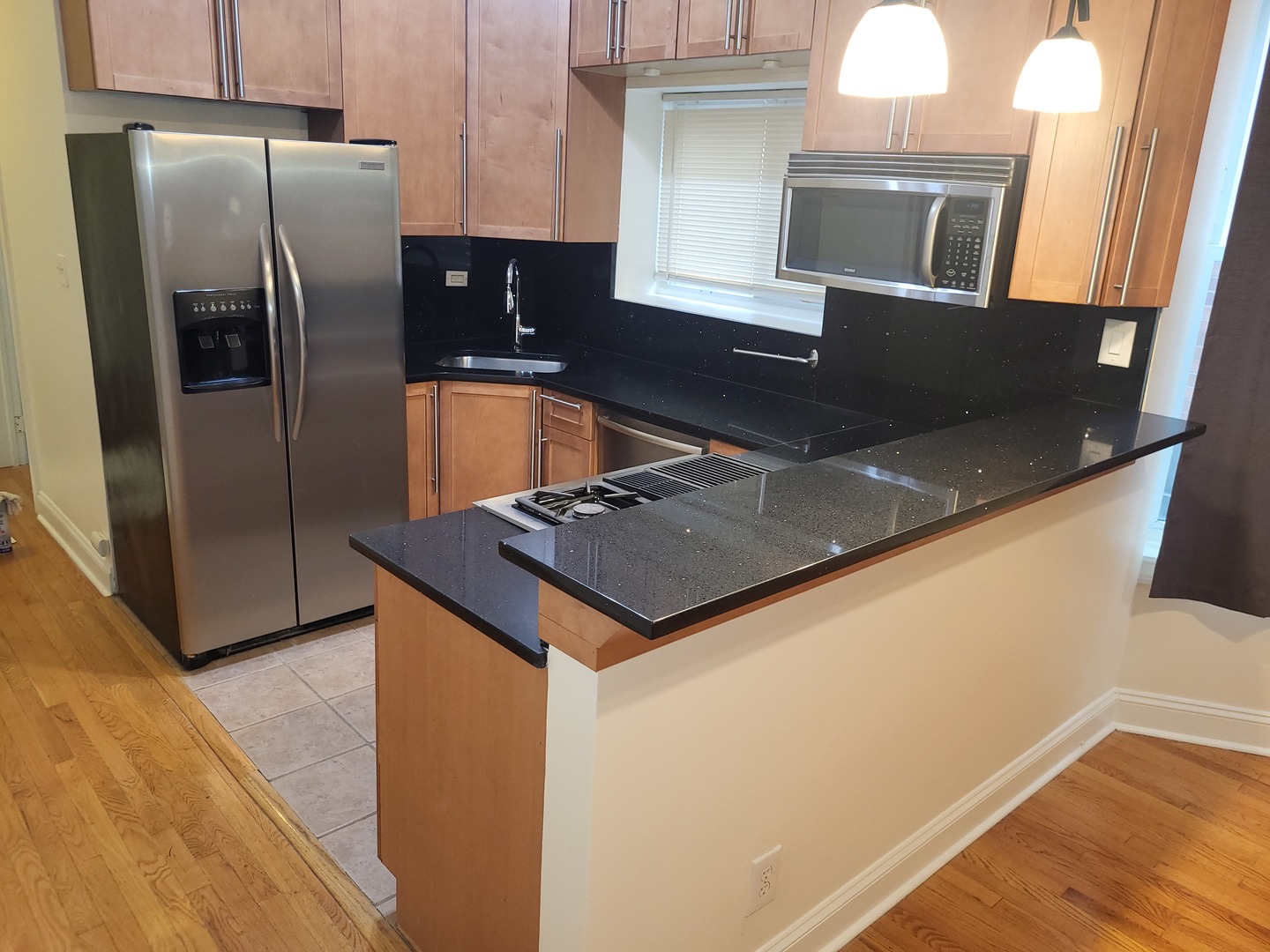 Undisclosed Address Chicago, IL 60622 - Photo 4 of 15 a kitchen with stainless steel appliances granite countertop a sink a refrigerator and a stove
