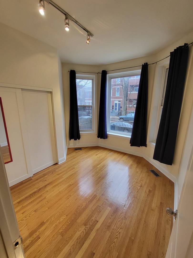 Undisclosed Address Chicago, IL 60622 - Photo 8 of 15 a view of a livingroom with wooden floor and a cabinet