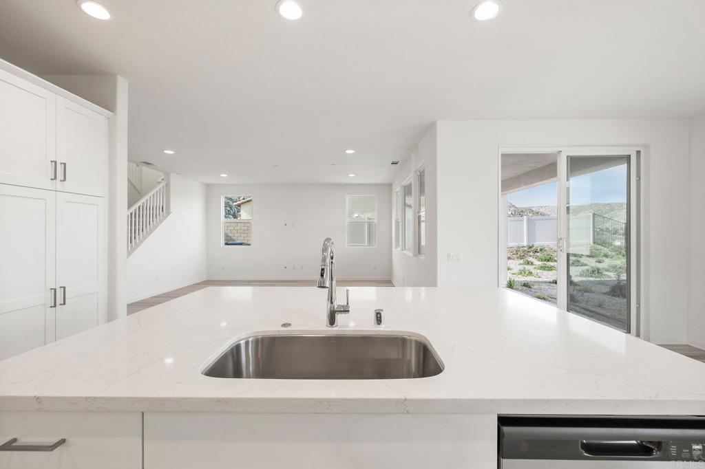 5384 Viewstone Court Hemet, CA 92545 - Photo 11 of 47 a bathroom with a sink and a large mirror
