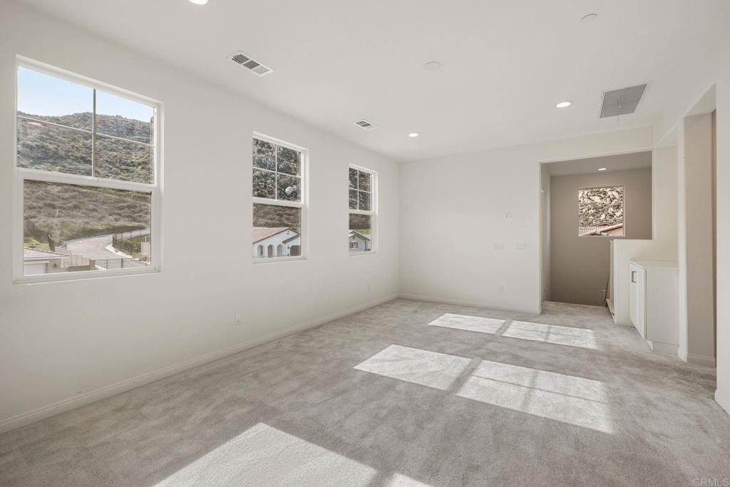 5384 Viewstone Court Hemet, CA 92545 - Photo 23 of 47 a view of an empty room with a window