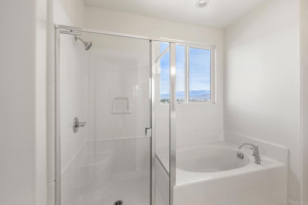 5384 Viewstone Court Hemet, CA 92545 - Photo 31 of 47 a bathroom with a bathtub and a shower