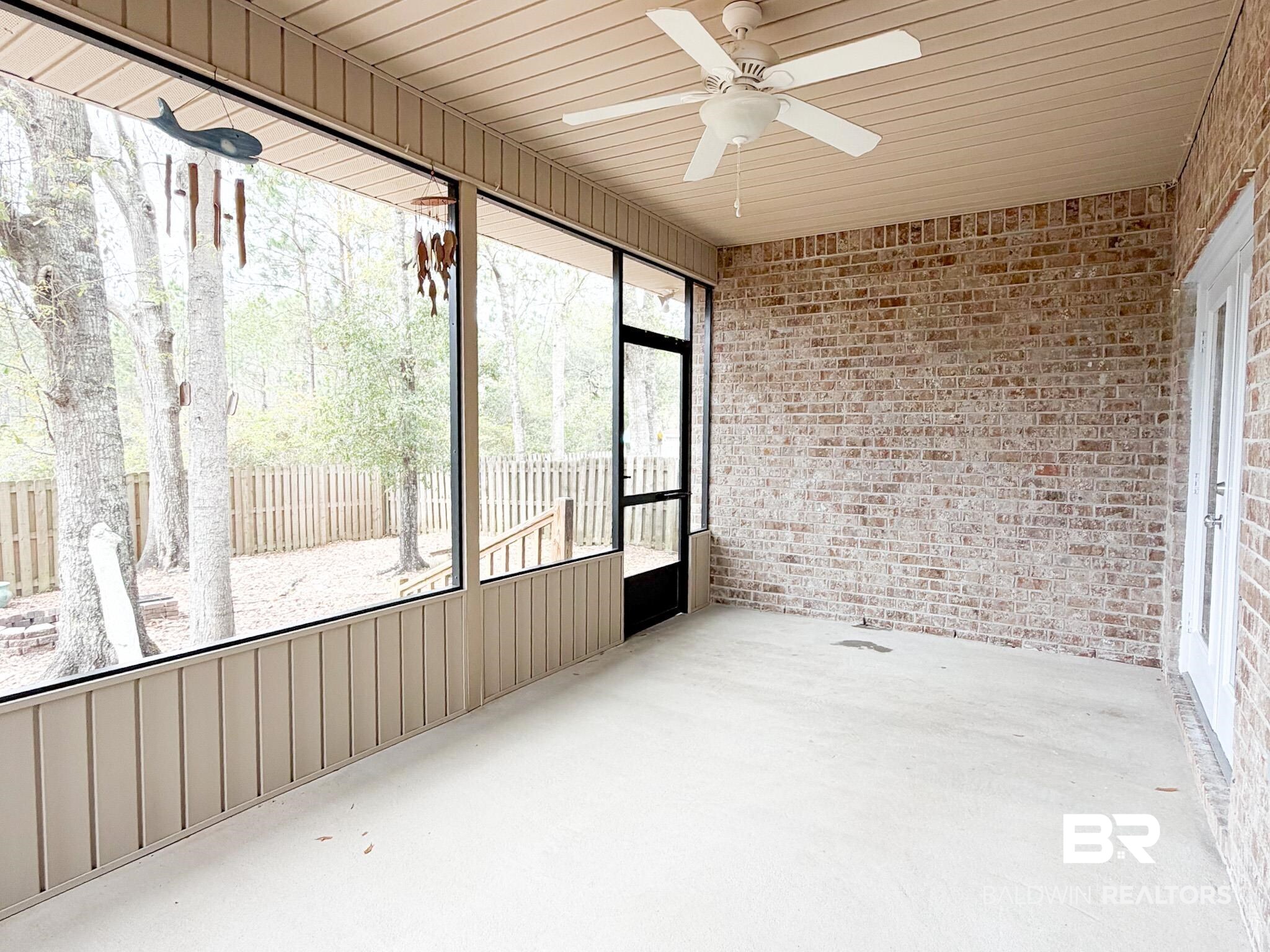 7332 Raintree Lane Gulf Shores, AL 36542 - Photo 21 of 21 Unfurnished sunroom with ceiling fan