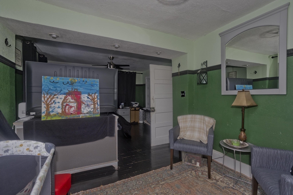 41 Embury Street Springfield, MA 01109 - Photo 15 of 41 a living room with furniture and a flat screen tv