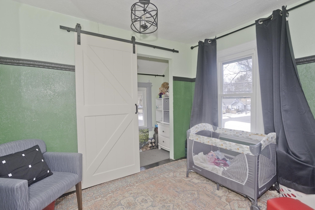 41 Embury Street Springfield, MA 01109 - Photo 16 of 41 a living room with furniture and a window